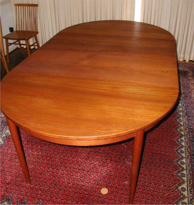 Very nice teak dining table. 8'x 4', with both leaves in place, as shown here. Very light wear. Stunning piece