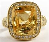 Lot#2065, 14.67CT NATURAL YELLOW SAPPHIRE & DIAMOND RING, GIA, SIZE 7.5..18kt yellow gold ladies ring, featuring a 14.67 carat cushion brilliant cut, no heat natural yellow sapphire at center, with 2.25 carats of round side diamonds. The total approximate weight of the ring is 17.3 grams.
