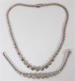 Lot#2073, 13.08CT DIAMOND NECKLACE & BRACELET SUITE, TWO, L 7"-16 1/2"18kt white gold suite, includes a 9.50 carat diamond necklace, measuring L. 16 1/2", and a 3.58 carat diamond bracelet, measuring L. 7". Having a total approximate weight of 49.2 grams.