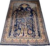 Lot#2225, TABRIZ PERSIAN HAND-WOVEN PRAYER RUG, W 4' L 6'Featuring the tree of life at the center, with bird and deer figures on a navy ground. Measures L. 6 ft. x 4 ft.