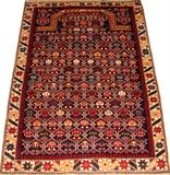 Lot#2235, CAUCASIAN HAND-WOVEN WOOL RUG, 4' 9" X 3' 6"Having a navy ground and an ivory border, with an all over stylized floral motif.