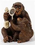 Lot#2282, JAPANESE CARVED WOOD & IVORY AMUSING GORILLA WITH CUB & MIRROR H 4 3/4" W 4"Signed; fitted box.