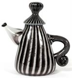 Lot#1007, MICHEL LECLERC, GLASS TEAPOT SCULPTURE, 1992, H 7", W 7 1/2"Michel Leclerc [Canadian, Contemporary]. Blown glass teapot, decorated in white and black stripes. Signed and dated at underside, measuring H. 7" x 7 1/2".