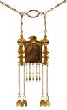 Lot#1026, EGYPTIAN REVIVAL 14KT YELLOW GOLD & FAIENCE NECKLACE, L 18"A yellow gold link chain with lavaliere in the form of  a hawk in profile, enclosing a pottery amulet depicting a fish, hung with gold fringe accented with semi precious stones.  Tests 14kt gold. Total weight 23.7gr.  Pendant is L.3".  Unidentified hallmarks each loop at either end (see additional photos).