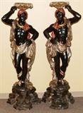 Lot#1044, VENETIAN CARVED & POLYCHROME BLACKAMOORS, PAIR, H 65", W 21"Carved wood, with polychrome decoration. Raised on rocky form bases, measuring H. 65" x 21".