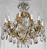 Lot#1051, VERSAILLES GOLD-PLATED TWELVE-LIGHT CHANDELIER, W 38"Eight lights. Scroll Arms, twelve lights, crystal prisms