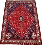 Lot#1186, ABADEH TRIBAL RUG, 5' 0" X 3' 7"A lozenge-form medallion centers the red ground, dark blue field with ivory medallion corners, stylized bird and floral motif overall.