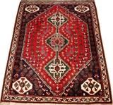 Lot#1185, QASHQAI TRIBAL RUG, 5' 3" X 4' 0",Triple-medallion at the center within diamond form, red and dark blue ground, stylized motif within the borders.