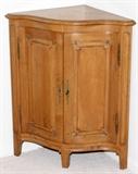 Lot#1277, ROUSSEAU WALNUT CORNER CABINET, H 34", W 29", D 20"Country French style, fitted with a pair of doors opening to three shelves. Quality furniture by a premiere manufacturer.