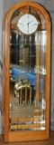 Lot#1284, HOWARD MILLER OAK TALL CASE CLOCK/CURIO CABINET, H 83", W 27", D 13"Etched glass panel opens to three glass display shelves, three-key wind, with pendulum.