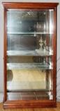 Lot#1285, HOWARD MILLER CONTEMPORARY DISPLAY CABINET, H 86", W 44", D 14"Fitted with four glass shelves, mirrored back, lighted interior.
