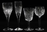 Lot#1391, WATERFORD 'CARLOW' & 'MICHELE' CRYSTAL STEMWARE, 13 PIECES."Carlow" pattern includes 3 water goblets, H.8 3/4", and 4 fluted champagnes, H.9 1/4", together with, in the "Michele" pattern, 4 water goblets, H.7", and 2 wine hocks in a similar pattern, H.7 1/2"; signed.
