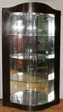 Lot#37, ELLO, MODERN STYLE ELECTRIFIED BOW FRONT CURIO, H 82", L 50", D 19"Having a contoured crest, mirrored interior, three fitted glass shelves and glass doors.