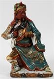 Lot#159, CHINESE PORCELAIN FIGURE, SEATED WARRIOR H 12"dressed in traditional garb with colorful headdress and finely adorned armor. Colors of green, wine, rose, gold, black and white. Signed on the underside;