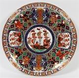 Lot#177, JAPANESE, BLACK SHIP IMARI PORCELAIN, CHARGER PLATE, C. 1890, DIA 13"depicts sailing ship in center of well, with two on sides. Signed on underside along with sailing ships.