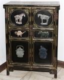 Lot#179, CHINESE BLACK LACQUER CABINET, H 34" W 24"Having two paneled doors, with applied carved hard stones featured on each. Decorated in floral and leaf motif, with fine gilt detailing. Measures H. 34" x 23 3/4" x 12".