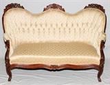 Lot#250, VICTORIAN WALNUT SOFA, H 34", W 54", D 26"having a carved acanthus leaf crest on back rest. Cabriole legs and carved front cross frame. Tufted upholstered cushion and back rest.