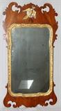 Lot#255, ENGLISH CHIPPENDALE STYLE MAHOGANY WALL MIRROR, H 36", W 19"Pierced carved crest featuring a gilt Phoenix at center, with carved gilt floral and leaf interior border. Measures H. 36" x 19".