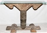 Lot#314, ISLAMIC CARVED ARCHWAY TABLE, H 33", W 12", L 49"Portion of an Islamic carved archway from Pakistan, converted to a glass top table. Decorated with repetitious floral designs in bas relief.
