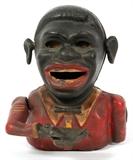 Lot#363, BLACK AMERICANA CAST IRON MECHANICAL BANK, EARLY 20TH C., H 6" W 4 1/2"/A cast iron mechanical bank, moving ears model. Measuring H. 6" x 4 1/2". Circa early 20th Century.