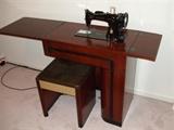 Singer sewing machine in cabinet - very nice shape