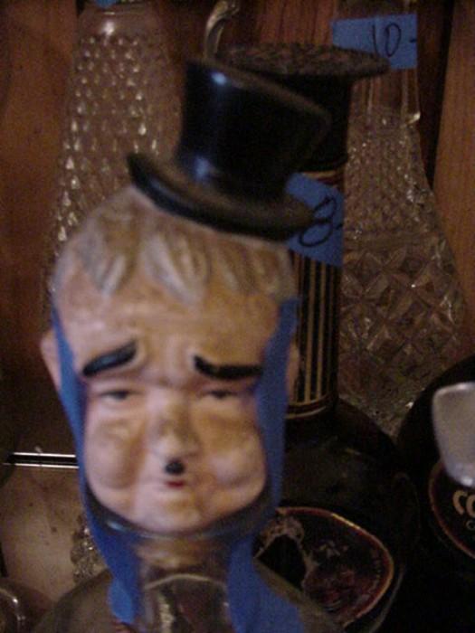 Bisque bottle stopper--Laurel and Hardy