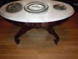 Oval marble coffee table with carved roses