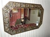 Antique beveled mirror with brass embossed roses and wood back