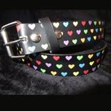 "2. Description: Show the world how much you 'heart' your dog! This sturdy collar is made from a vintage belt of fun multi-color hearts. This is absolutely a one of a kind collar! There will never be another like it. I haunt the thrift stores and find the coolest belts that will become the MOST fabulous collars! This is recycling and upcycling at its finest. Made of bonded leather, so it will securely hold even the most energetic of big dogs. Sturdy hardware makes this functional as well as fashionable. Measures 1.5"" wide. This collar can be made to fit any LARGE or MEDIUM neck size. Measure around dog's neck where collar will fit, and let me know measurement. I will fashion the collar using the buckle and keeper shown (plus a D ring for leash attachment). I will build in 2"" of adjustment in either direction so you can make the fit absolutely comfy once you have it on your dog. Winner will send neck size to seller "
Donor: Lisa Williams-Whitmer
Shipping: Yes, paid for by donor