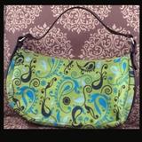 Initials, Inc. Sassy Bag - Hobo style - Oasis pattern Approx. 15 inches wide at largest point and 8 inches deep/zippered closure/small zippered pocket inside of bag 8 inches wide.
Size:Approx. 8" x 15"
Donor: Ruth Ann Neiman
Shipping: Yes, paid for by donor