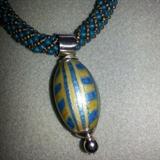 Spiral rope necklace with handmade polymer bead - all sterling silver findings. Clasp is magnetic sterling silver. Many hours invested to craft this necklace. it’s a short necklace, 16 inches, designed to rest at the base of your throat. It cannot be altered to be made longer. Bead is handcrafted and is made of polymer clay mounted on a sterling silver setting
Size: 16"
Donor: Joanne Cassulo
Shipping: Yes, paid for by donor 