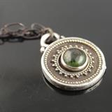 1” round fine silver and 22k granulated pendant with 5mm green tourmaline cabochon bezel set on an 18” oxidized silver chain with forged clasp - Handcrafted in NC
Size: 18"
Donor: Susan McDonough
Shipping: Yes, paid for by donor 