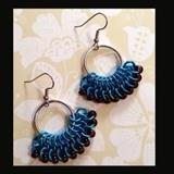 Hoops with Blue-made with bright aluminum, anodized aluminum, and glass beads. Excluding the ear-wires, they are 1.5" long. Very lightweight.
Size: 1 1/2"
Donor:Carol Collett
Shipping: Yes, paid for by donor 