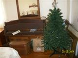 faux x-mas tree, dresser with mirror , wood rope bed.