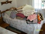 twin bed and some of the linens and bedding.