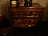Two-drawer chest with carved drawer fronts