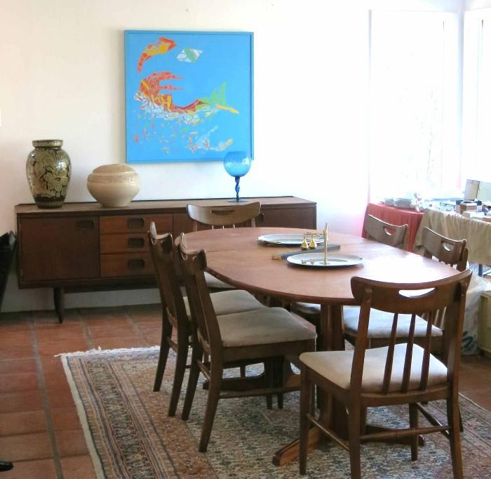 Danish Modern dining set and credenza or sideboard on oriental rug, painting by homeowner