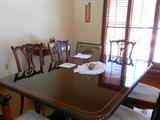 Chippendale  dining  room  table, 8 chairs  and  pads