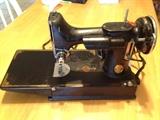 Small Black portable Singer sewing machine.  