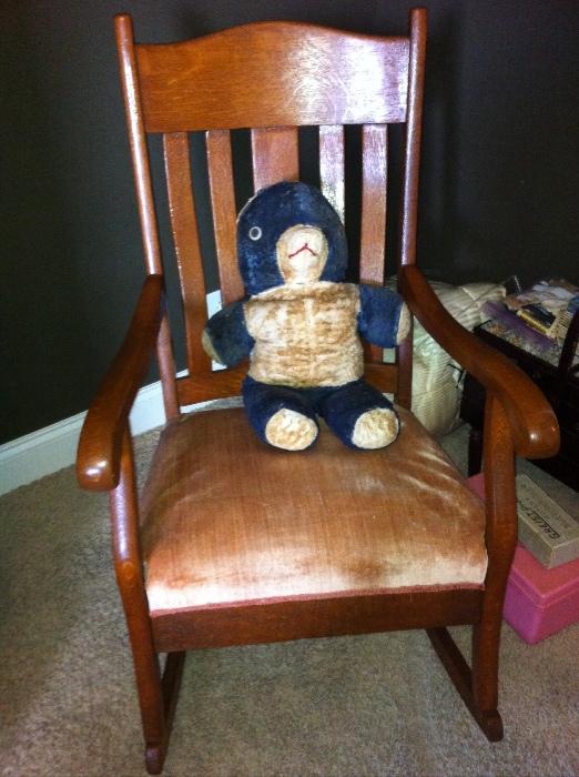 Antique oak rocking chair and well-loved bear.