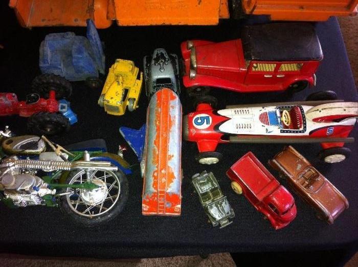 Vintage die cast and tin toy vehicles.