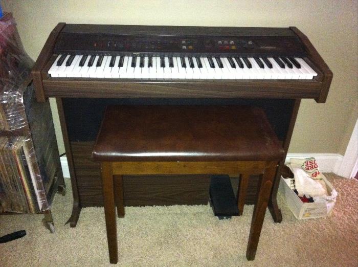 Vintage Lowry organ and bench.