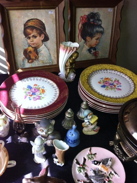 Vintage figurines and decorative plates.
