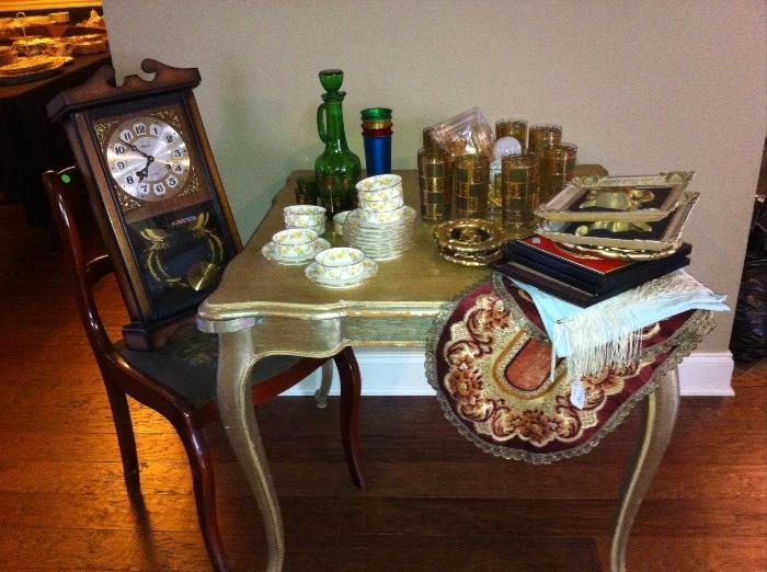 Vintage gold-leaf game table and assorted décor.