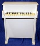 White Child`s Posing Piano Style Covered Xylophone