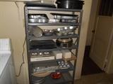 Lots of pots and pans, kitchen utensils