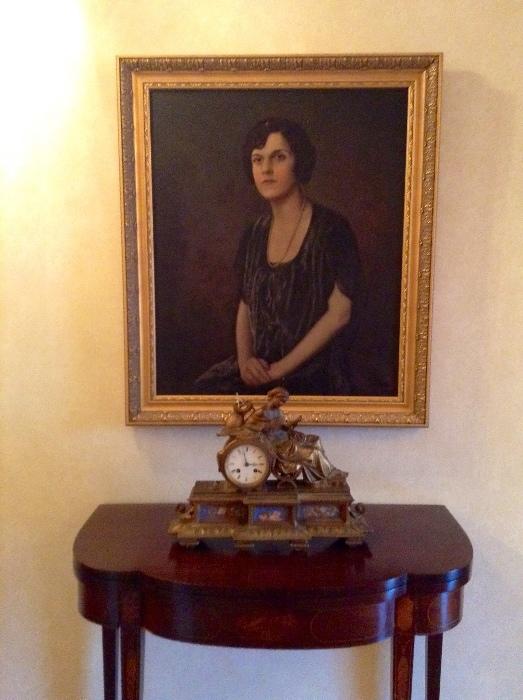 Lovely antiques: oil on canvas portrait, clock, and table