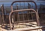 Antique bed with rails and two Singer sewing machine bases