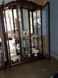 Display cabinet with glass back and lights by Philip-Reinisch Company 848 Lighthouse Collection Oxford Curio Cabinet - new $1700 each
 Height: 6 feet 9 inches
 BackToFront: 17 inches
 Width: 4 feet 7 inches