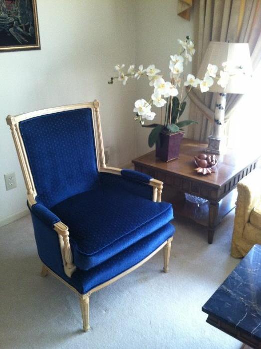 Louis XVI style upholstered bergere chairs (set of 2) circa 1940. The arm rests supported by fluted columns and the whole resting on stop fluted legs.